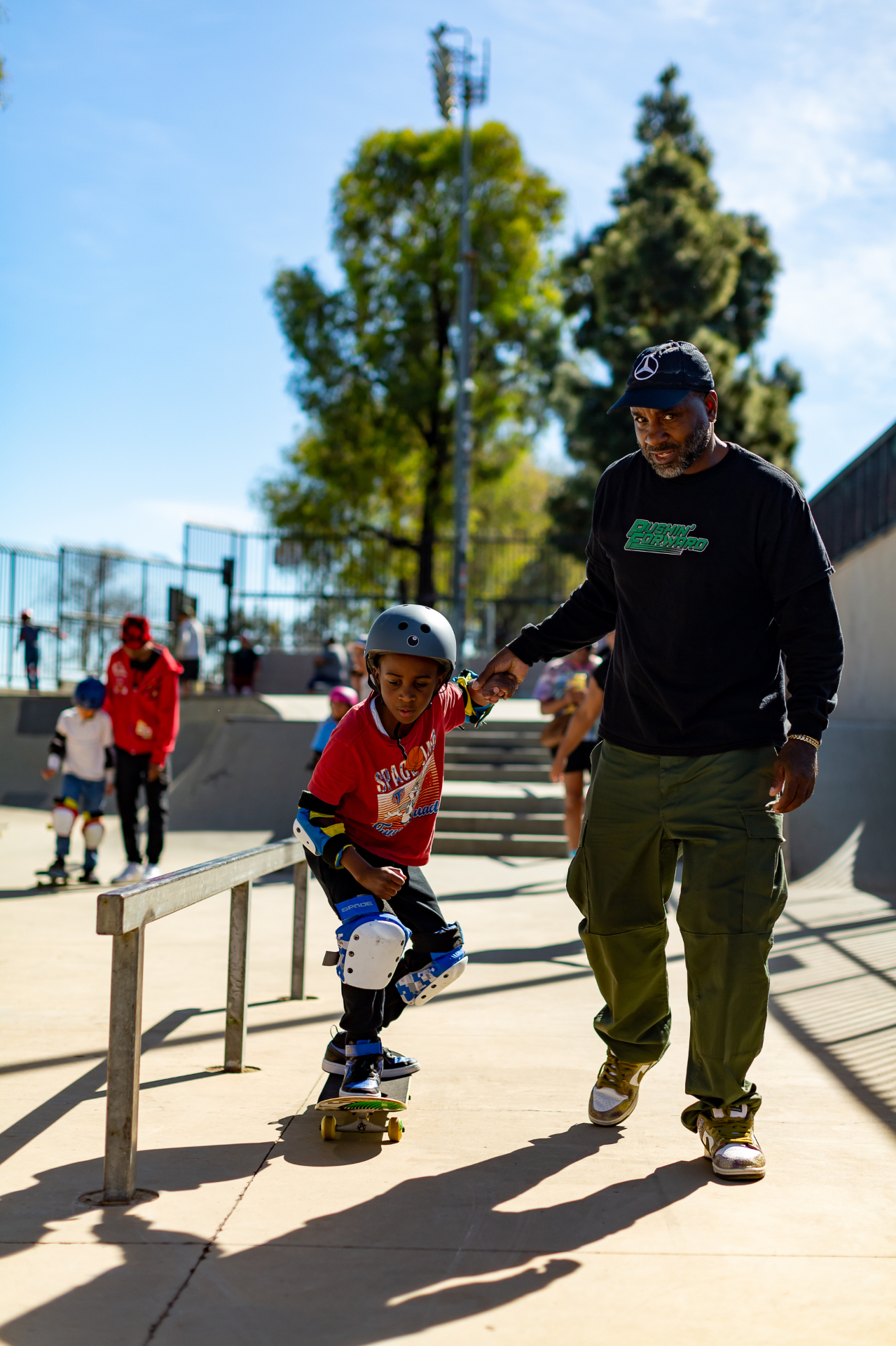 Coach Cooley mentoring a young skater